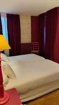 Un ou plusieurs lits dans un hébergement de l'établissement Hôtel du Palais