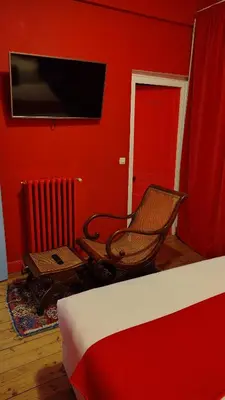 Télévision ou salle de divertissement dans l'établissement Hôtel du Palais