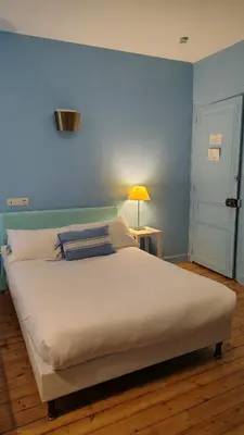 Un ou plusieurs lits dans un hébergement de l'établissement Hôtel du Palais