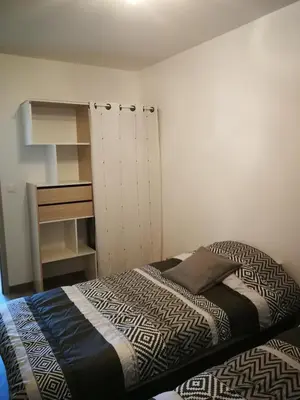 Un ou plusieurs lits dans un hébergement de l'établissement beau T2 lumineux 1er etage