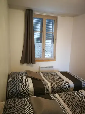 Un ou plusieurs lits dans un hébergement de l'établissement beau T2 lumineux 1er etage