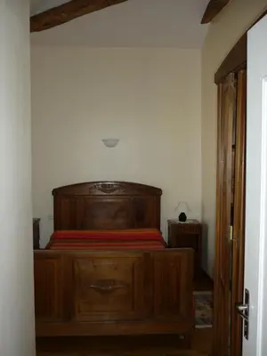 Un ou plusieurs lits dans un hébergement de l'établissement Gîte Le Logis de Faugerit