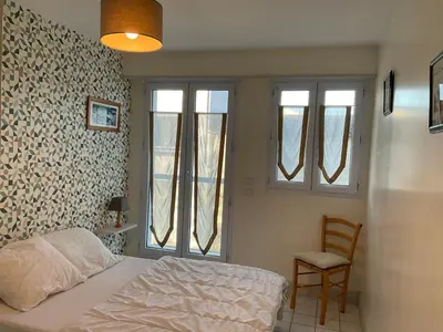 Un ou plusieurs lits dans un hébergement de l'établissement Appartement centre ville près du port avec parking et wifi