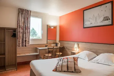 Un ou plusieurs lits dans un hébergement de l'établissement Ace Hotel Poitiers