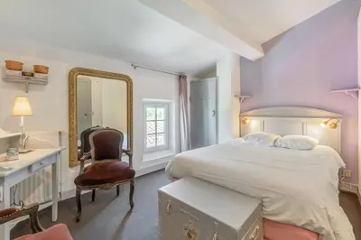 Un ou plusieurs lits dans un hébergement de l'établissement Chambres d'Hôtes - Les Bujours