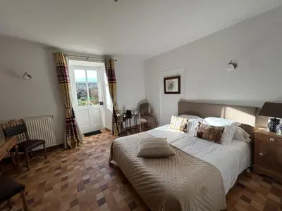 Un ou plusieurs lits dans un hébergement de l'établissement Le Vieux Chateau