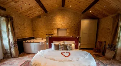 Un ou plusieurs lits dans un hébergement de l'établissement Demeures et Châteaux - Le Portail en Marais Poitevin
