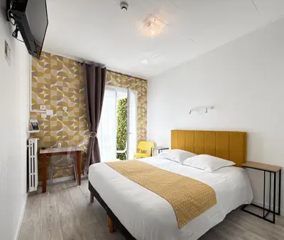 Un ou plusieurs lits dans un hébergement de l'établissement Hotel de Paris