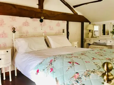 Un ou plusieurs lits dans un hébergement de l'établissement La Blatière French Cottages