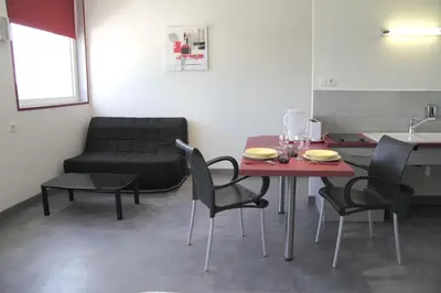 Coin salon dans l'établissement West Appart' Hôtel