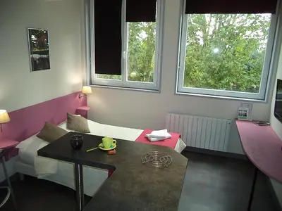 Coin salon dans l'établissement West Appart' Hôtel