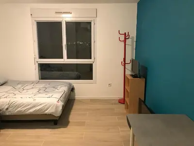 Un ou plusieurs lits dans un hébergement de l'établissement Appartement Futuroscope-J'