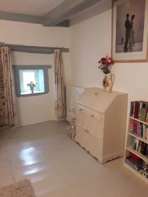 Un ou plusieurs lits dans un hébergement de l'établissement La Maison Des Fleurs