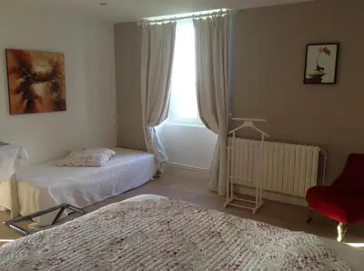 Un ou plusieurs lits dans un hébergement de l'établissement Chambres d'Hôtes La Pocterie