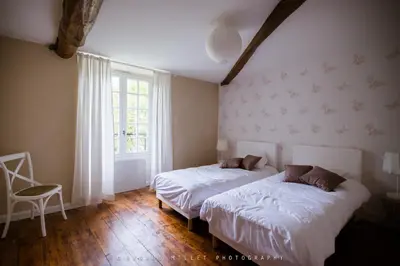 Un ou plusieurs lits dans un hébergement de l'établissement Maison d'hôtes le Moulin de Bois Coûtant