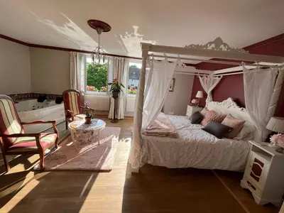 Un ou plusieurs lits dans un hébergement de l'établissement Les Bruyeres Chambres dhotes et Gite