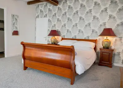 Un ou plusieurs lits dans un hébergement de l'établissement AUBERGE DU NOYER