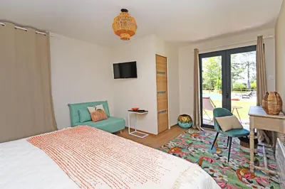 Un ou plusieurs lits dans un hébergement de l'établissement L Esprit du Clain chambres d hôtes au calme proches du Futuroscope Golf et Lac de St Cyr