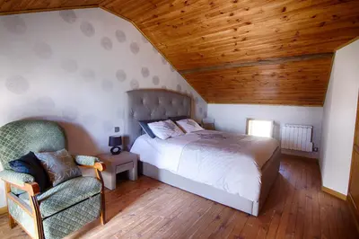 Un ou plusieurs lits dans un hébergement de l'établissement Chambre d'hôtes Au Chant des Vents