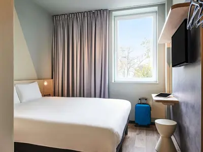 Un ou plusieurs lits dans un hébergement de l'établissement ibis budget La Rochelle Centre les Minimes