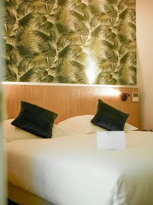 Un ou plusieurs lits dans un hébergement de l'établissement Best Western Le Bois de la Marche