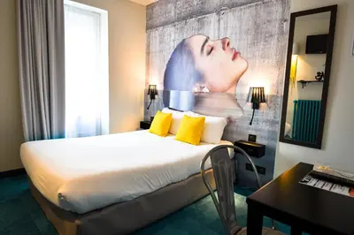 Un ou plusieurs lits dans un hébergement de l'établissement Hôtel Le Bord'O Vieux Port