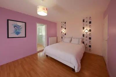 Un ou plusieurs lits dans un hébergement de l'établissement Gîte La Loge des Fées
