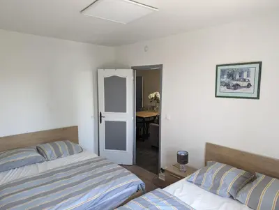 Un ou plusieurs lits dans un hébergement de l'établissement Appartement meublé proche du futuroscope