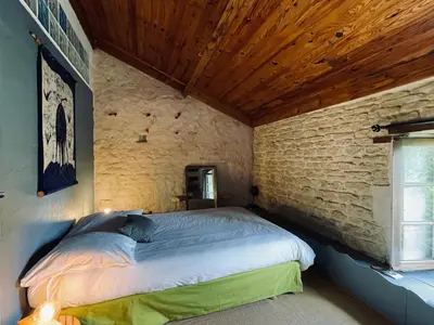 Un ou plusieurs lits dans un hébergement de l'établissement Zen au Marais Hammam Massages