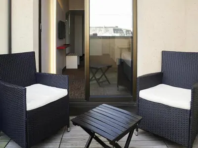 Coin salon dans l'établissement ibis Styles Poitiers Centre