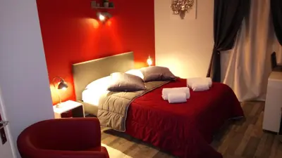 Un ou plusieurs lits dans un hébergement de l'établissement Hôtel Montespan