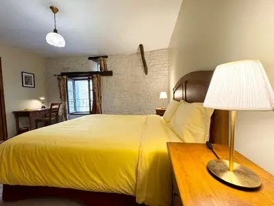 Un ou plusieurs lits dans un hébergement de l'établissement Le Relais de Saint-Preuil, The Originals Relais Vignes du Cognac