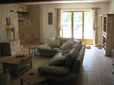 Coin salon dans l'établissement Gite du Puits - Bréville