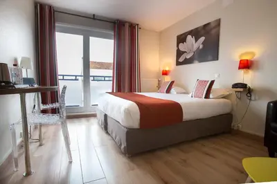 Un ou plusieurs lits dans un hébergement de l'établissement Logis Hotel Epi d'Or