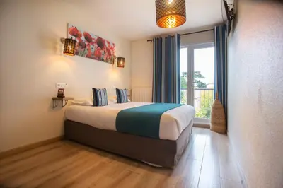 Un ou plusieurs lits dans un hébergement de l'établissement Logis Hotel Epi d'Or