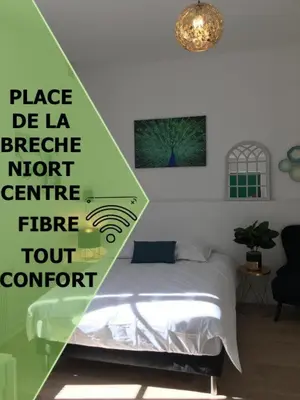 Un ou plusieurs lits dans un hébergement de l'établissement Le Bahia centre la Brèche wifi linge de pressing