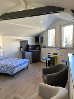 Un ou plusieurs lits dans un hébergement de l'établissement Studio Cosy
