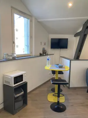 Télévision ou salle de divertissement dans l'établissement Studio Cosy