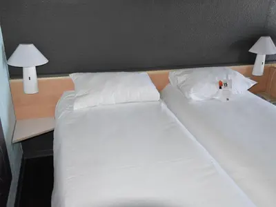 Un ou plusieurs lits dans un hébergement de l'établissement ibis Rochefort