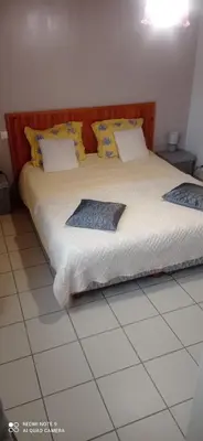 Un ou plusieurs lits dans un hébergement de l'établissement Chambre d'Hôtes Les Ormeaux