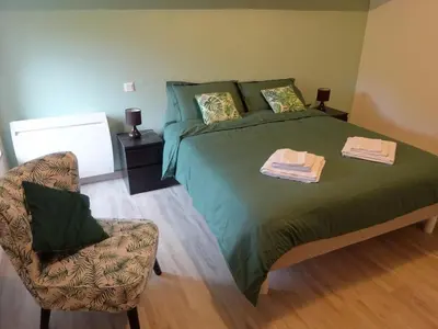 Un ou plusieurs lits dans un hébergement de l'établissement Le Cottage de Paul et Angéline