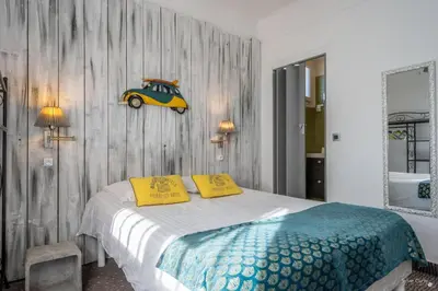 Un ou plusieurs lits dans un hébergement de l'établissement Hotel La Roseraie