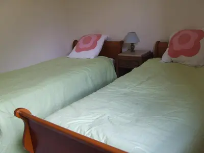 Un ou plusieurs lits dans un hébergement de l'établissement Gite à la ferme Les places