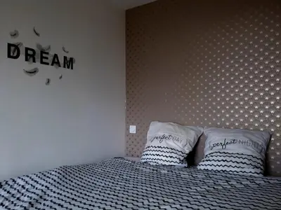 Un ou plusieurs lits dans un hébergement de l'établissement Futuroscope appartement 40m2 à 7 min du parc