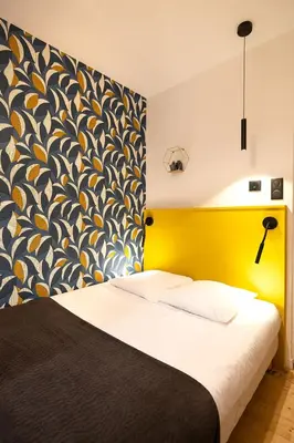 Un ou plusieurs lits dans un hébergement de l'établissement Hotel de La Paix