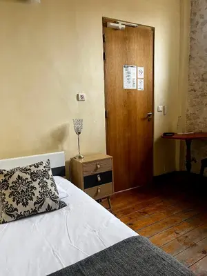 Un ou plusieurs lits dans un hébergement de l'établissement Hotel de La Paix