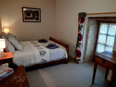 Un ou plusieurs lits dans un hébergement de l'établissement Wisteria Cottage