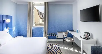 Un ou plusieurs lits dans un hébergement de l'établissement Best Western Plus Poitiers Centre Le Grand Hotel