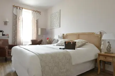 Un ou plusieurs lits dans un hébergement de l'établissement Grand Hôtel des Bains SPA