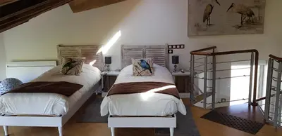Un ou plusieurs lits dans un hébergement de l'établissement La maison triangulaire